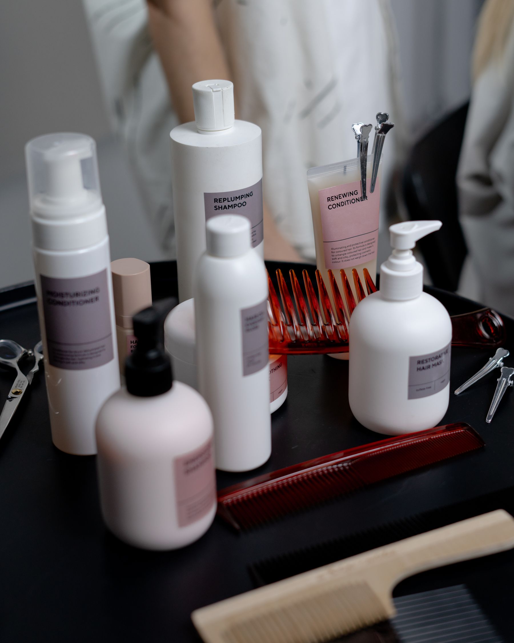 Hair care bottles on a salon counter